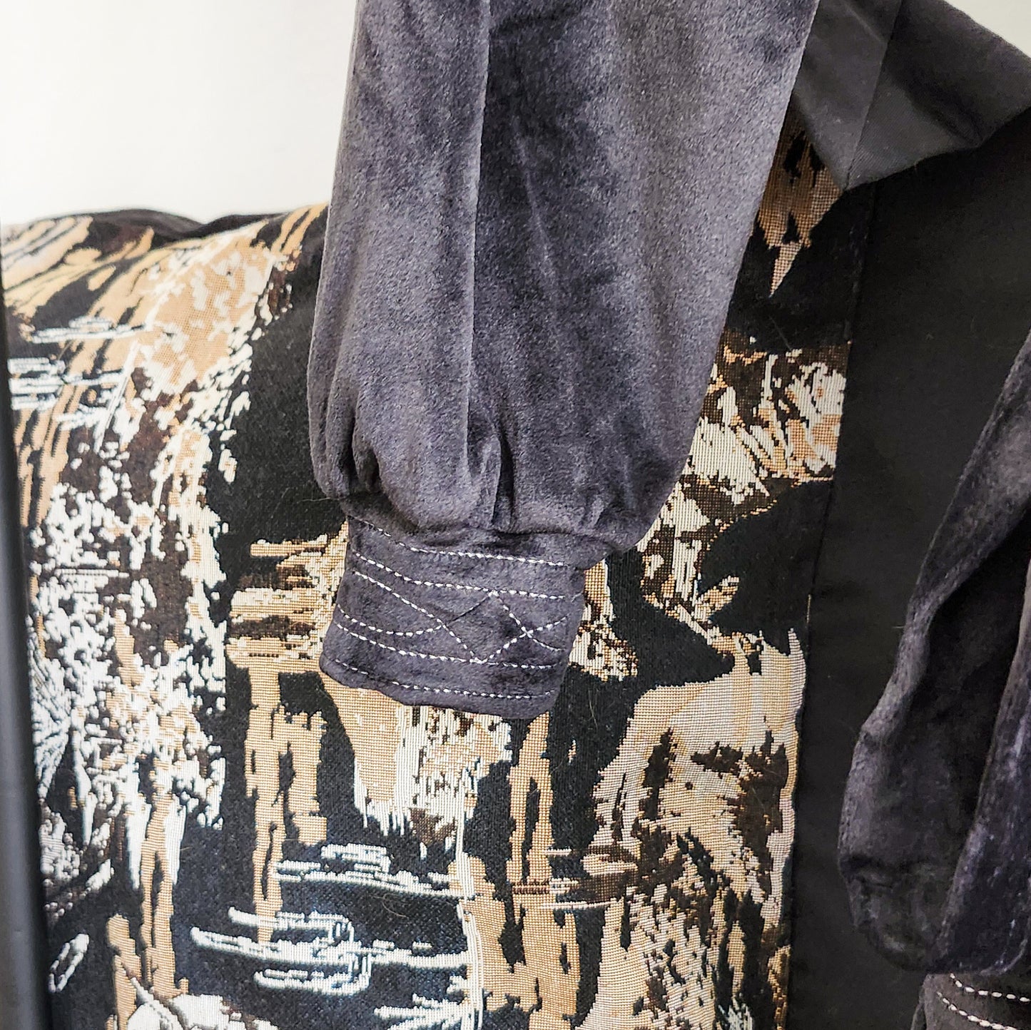 boot stitch bathrobe sleeve detail featuring western-inspired stitching pattern