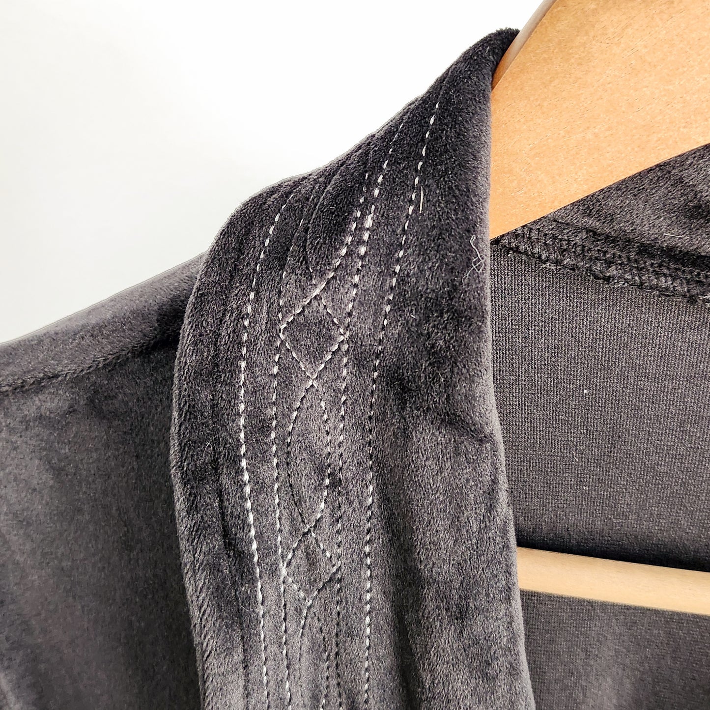 Black velvet boot stitch bathrobe with western stitched collar detail close-up